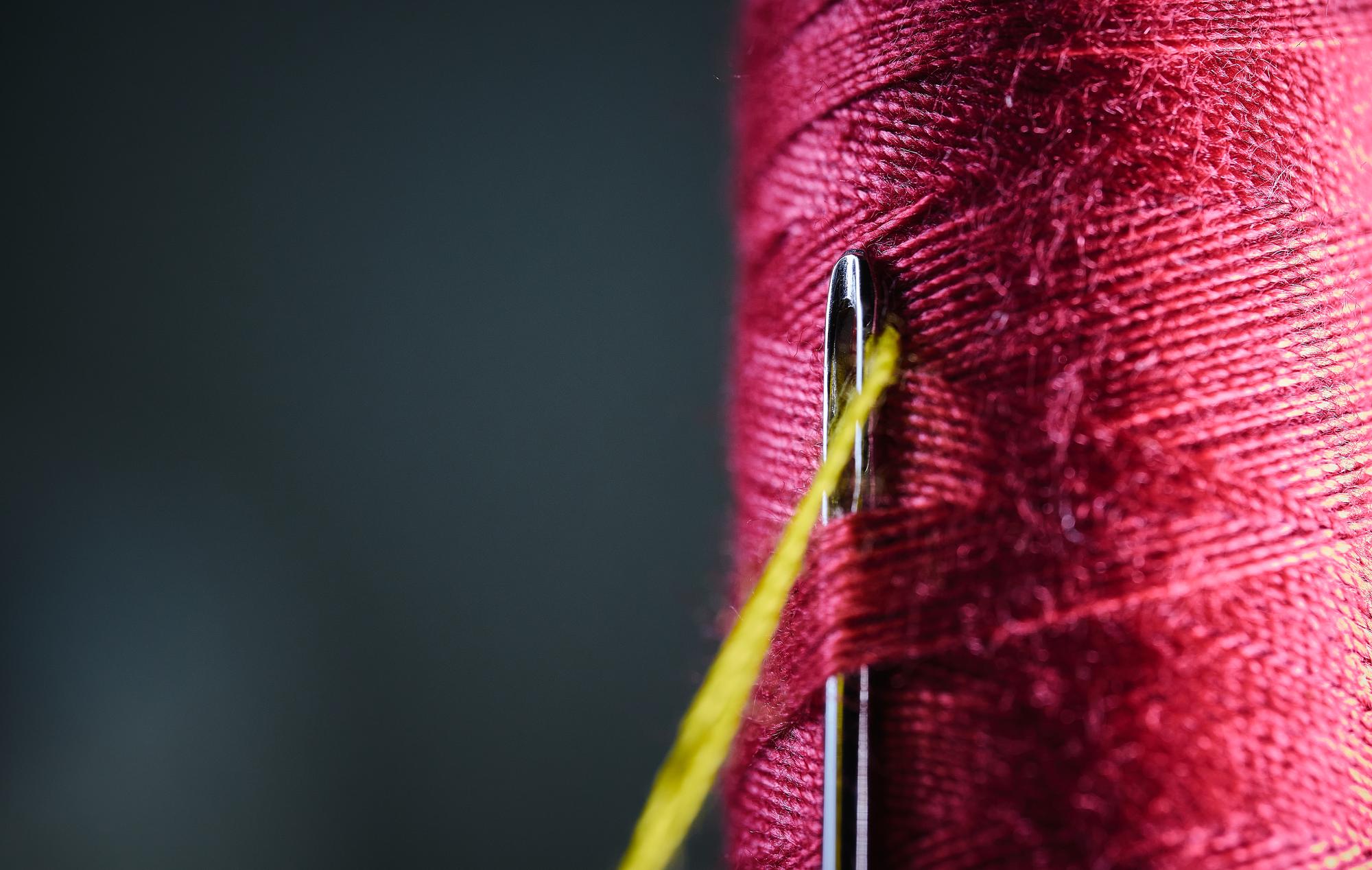 Close-up of embroidered textile with fine threads